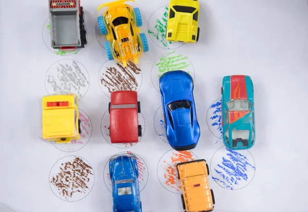 parking of small model cars on paper childhood plaything