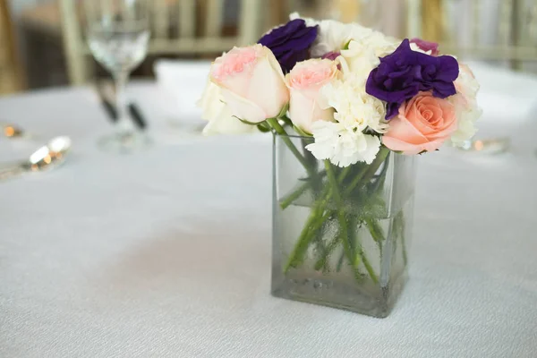 Flower table decorations for holidays and wedding dinner. Party or wedding reception in restaurant