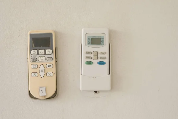 Air conditioner remote control on white wall
