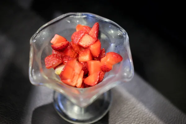 Strawberry slices for topping dessert in a bowl glass