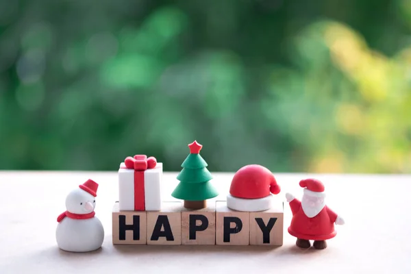 HAPPY word made of wood cubes with ornament in Christmas, Festive art Christmas concept