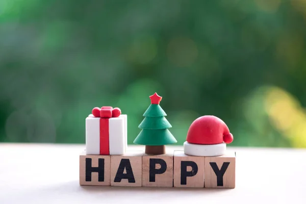 HAPPY word made of wood cubes with ornament in Christmas, Festive art Christmas concept