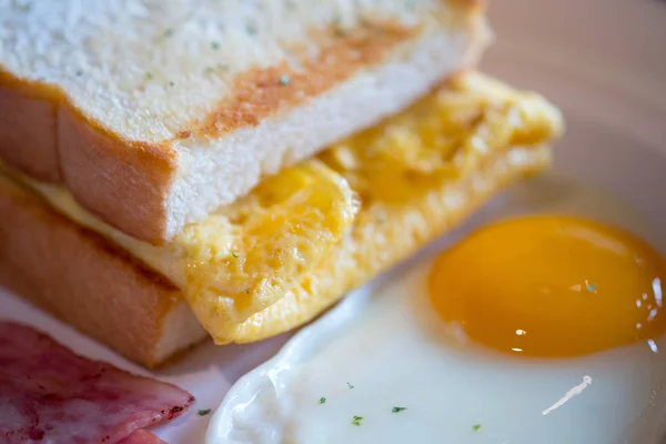 Close up breakfast with toast and fried yolk yellow eggs. Breakfast concept