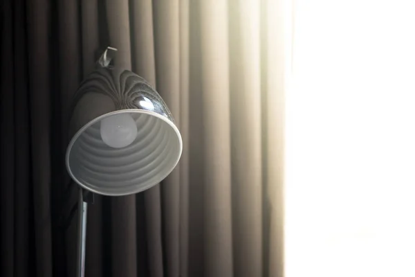 Table lamp with gray shade. Beautiful decor of the room.