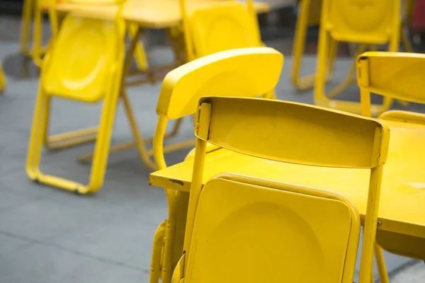 Yellow steel chair at outdoor restaurant prepare for open restaurant or beer garden