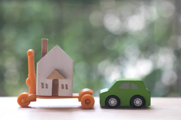 Miniature car and houses for dreaming everybody want to owner. Property or Assets for future planning stability can be exchanged for life. Saving or real estate investment concept