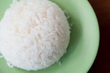 Thai jasmine rice or white rice in green dish