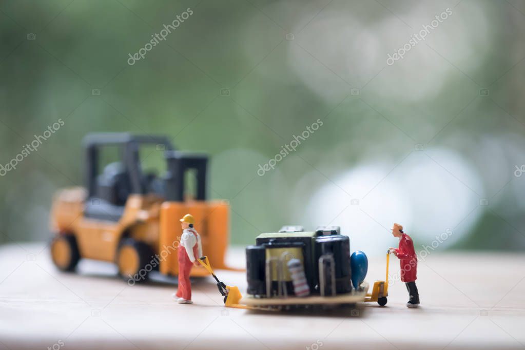 Miniature workers moving USB for repair. Concept of fixing electronic hardware and computer industry.