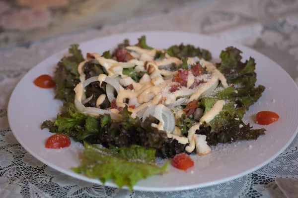 Caesar salad in a white dish. — Stock Photo, Image