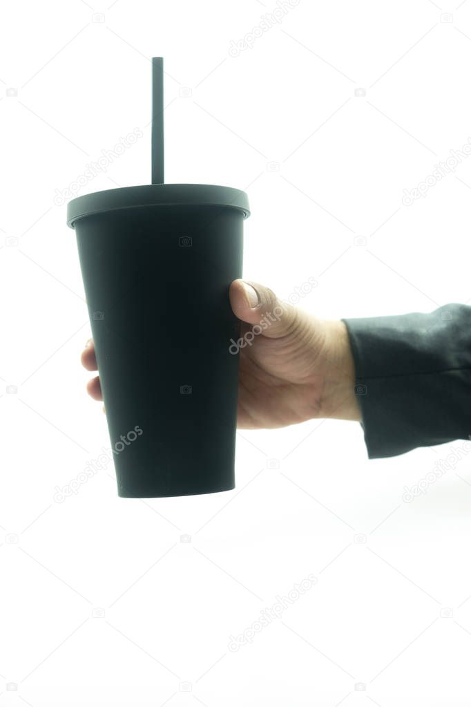 Businessman hand keep black thermo cup 
