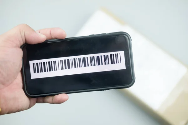 Shipping barcode on mobile phone screen with box