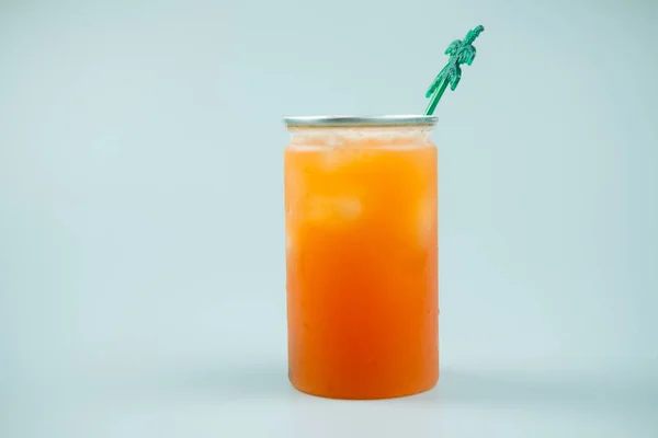 Plastic glass of iced peach soda — Stock Photo, Image