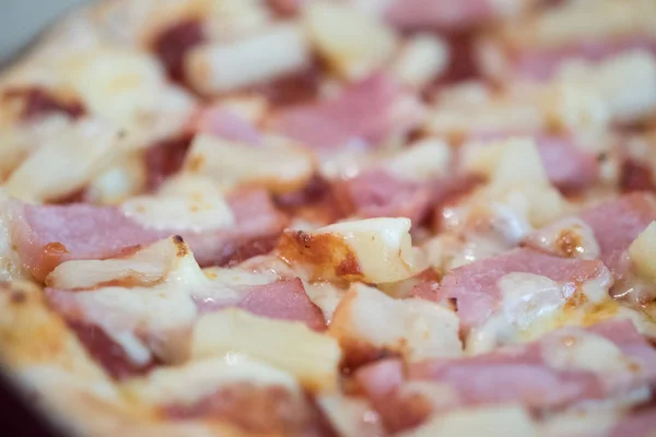 Delicious ham and pineapple pizza with cheese