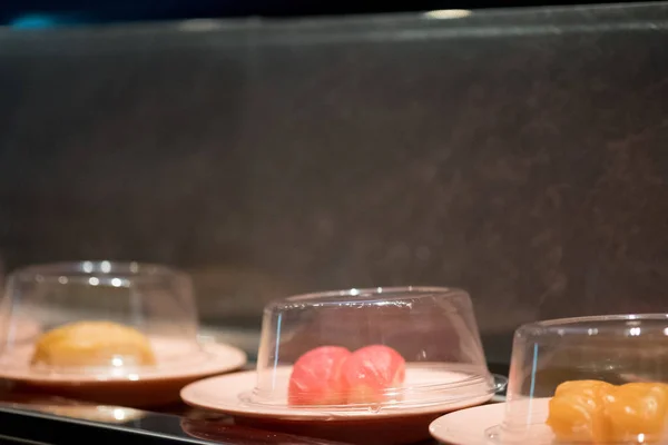 Japan food on conveyor buffet of sushi in restaurant