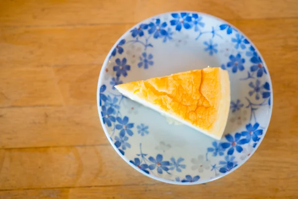 A piece of sponge cake bread on dish. — Stock Photo, Image