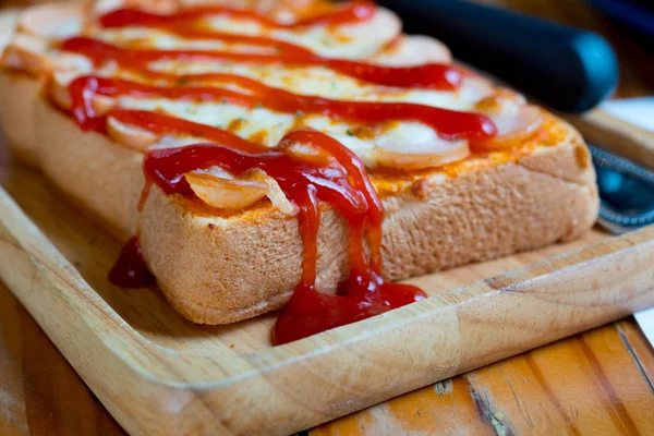 Pizza toasted bread with tomato sauce