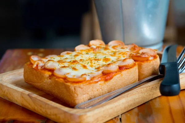 Pizza toasted bread and hotdog cheese.