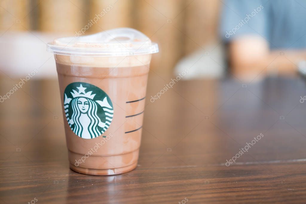 Bangkok, Thailand - August 8, 2019. Starbucks cold mocha drink in plastic cup (Cold brew coffee). Famous coffee brand franchise originated in USA