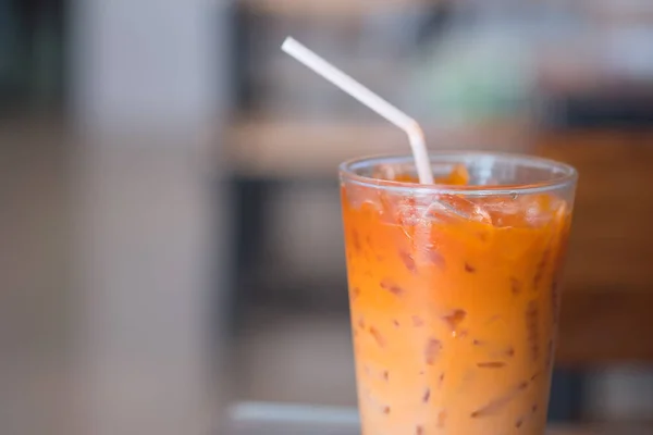 Thai milk tea in glass with straw — Stock Photo, Image