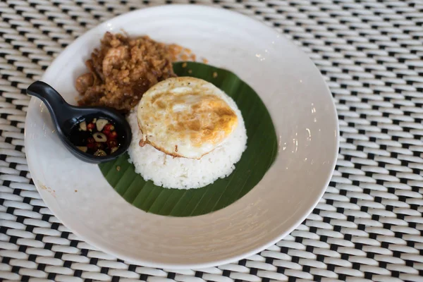 Steam rice with fried egg and stir-fried pork with garlic,Thai food.