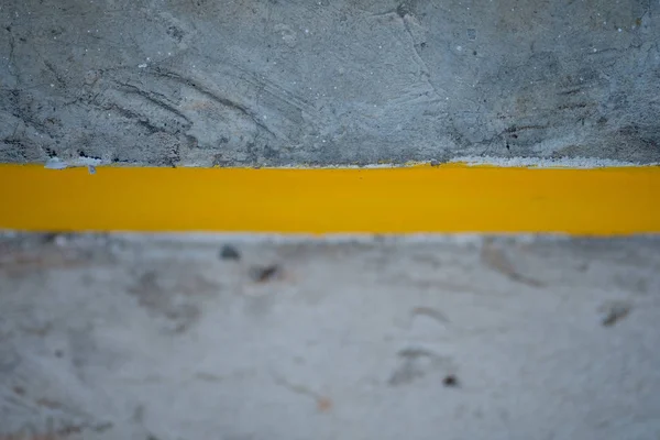 Yellow lines on cement road