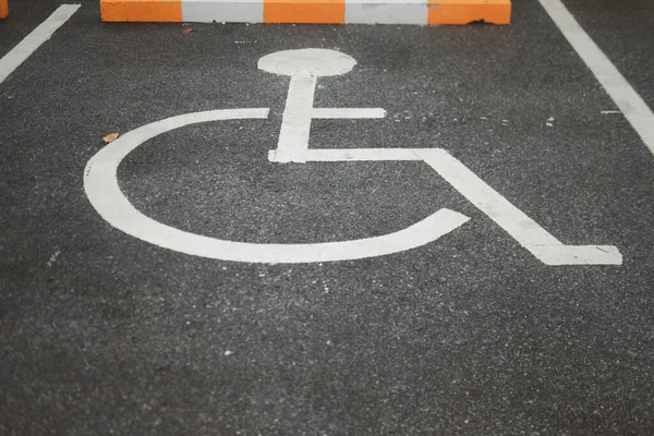 Handicap parking areas reserved for disabled people. Disabled parking sign