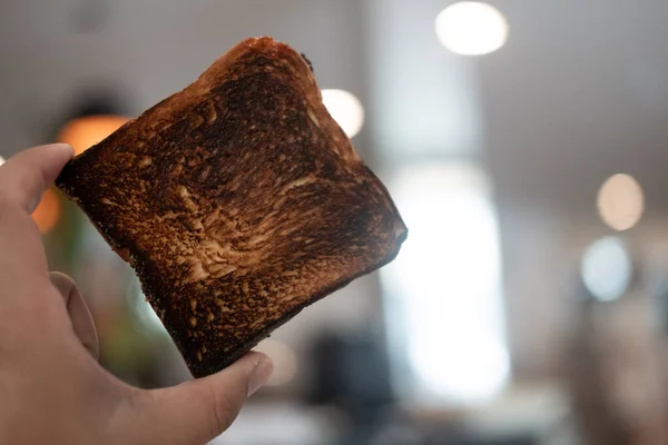 Man Holding Burnt Toast Bread Slice Close — Stock Photo, Image