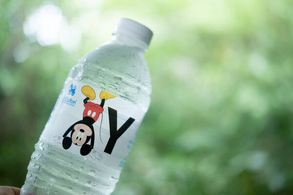 Bangkok, Thailand - August 16, 2020 : Plastic bottle drink water of Singha Water is new collection Mickey Mouse Collection. The brand is SINGHA, one of most famous beverage brand in Thailand.