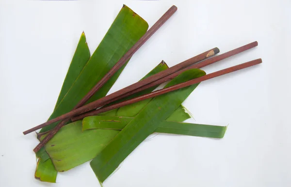 Two Wooden Chopsticks Put Banana Leaf White Background — Stock Photo, Image