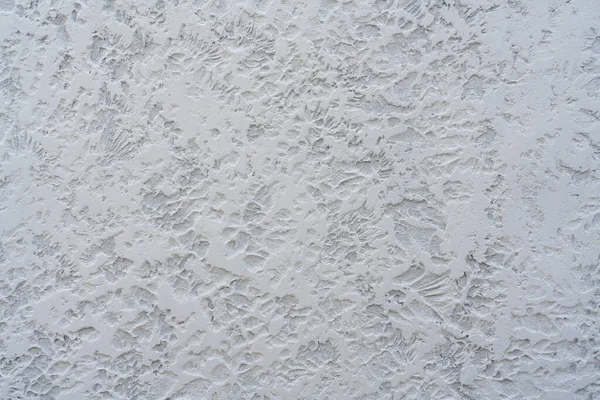 Beyaz beton duvar panelinin kabataslak desenli arka plan fotoğraf dokusunu kapat.