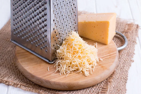Grated Cheese Wooden Cutting Board Closeup — Stock Photo, Image