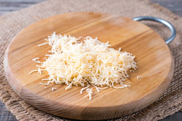 Grated Cheese Cutting Board Table — Stock Photo, Image