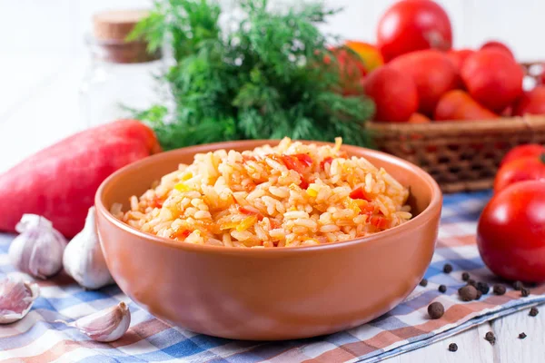 Mexican Rice - Rice cooked with tomato sauce in a ceramic bowl