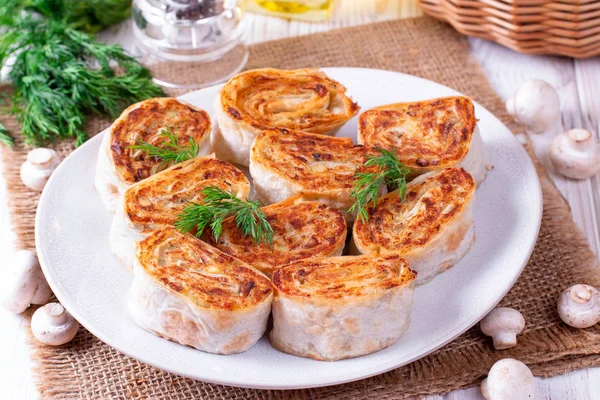 Fried lavash rolls with potatoes and mushrooms — Stock Photo, Image