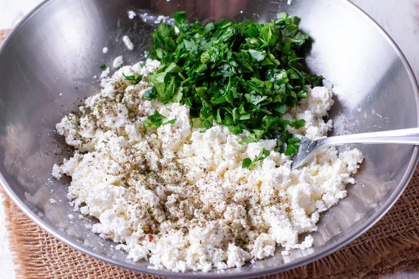 Fresh cottage cheese with herbs and spices in a metal bowl — Stock Photo, Image