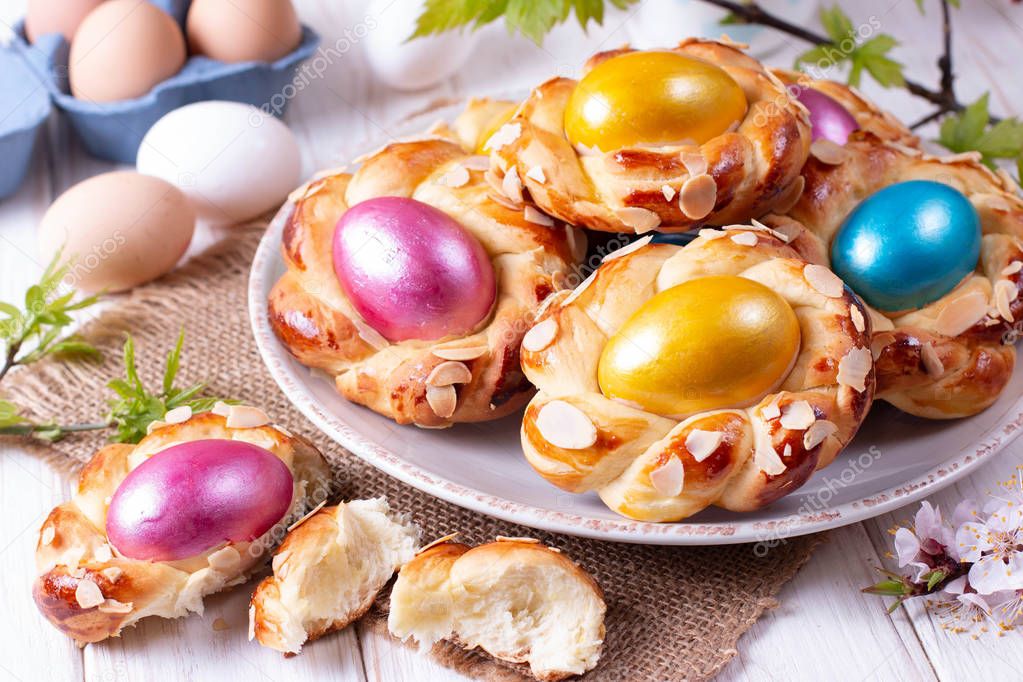 Traditional Italian Easter bread rings, decorated with colorful eggs
