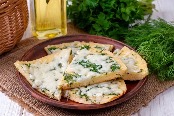 Pancake with cheese and herbs on a plate — Stock Photo, Image