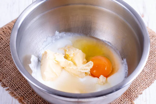 stock image Mixing butter, sugar and eggs in bowl with mixing machine