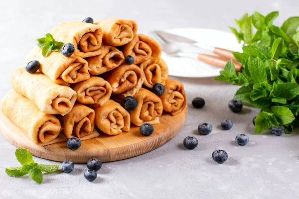 Delicious Sweet Rolled Pancakes Cottage Cheese Fresh Fruits Wooden Board — Stock Photo, Image