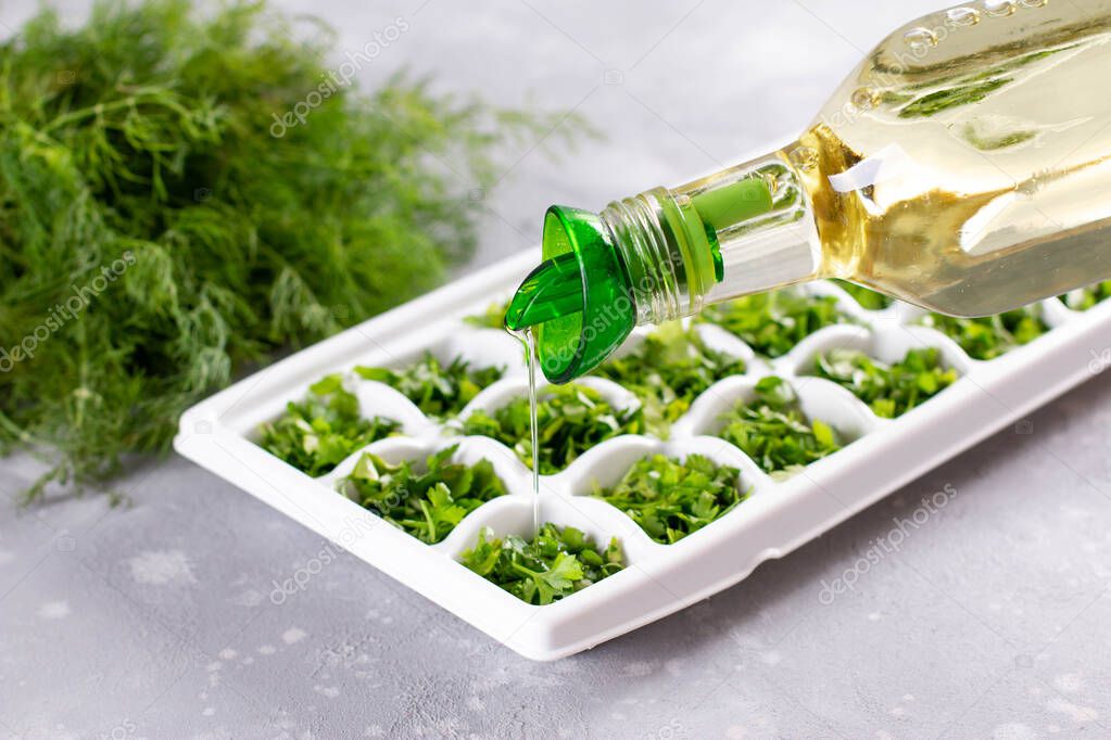 Frozen Herb Butter In White tray, Olive Oil With herbs on light background.