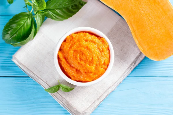 Organic pumpkin puree (soup) in a white bowl. Dietary dish. Baby food. The top view — Stock Image Organic Pumpkin Puree Soup White Bowl Dietary Dish Baby Food Stock Picture
