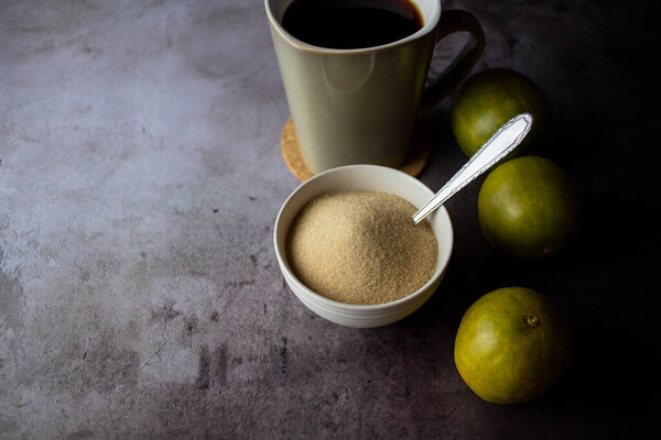 dried monk fruit, luo han guo, and monk fruit sugar crystals accompanied with a cup of tea or coffee