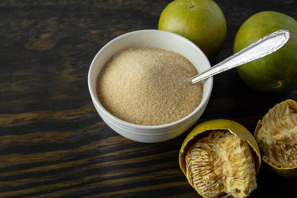 dried monk fruit, luo han guo, and monk fruit sugar crystals accompanied with a cup of tea or coffee