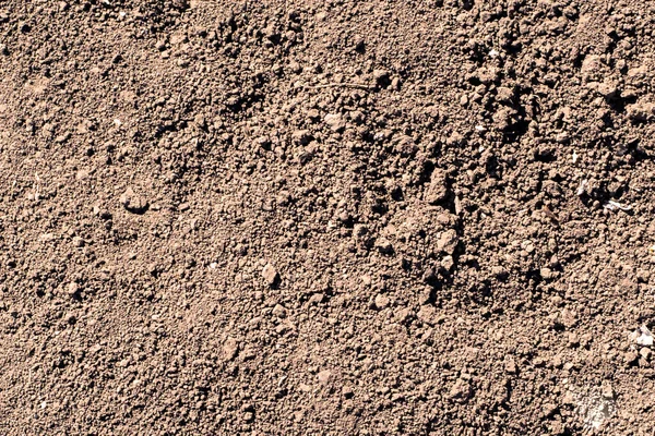 Erdstruktur Mit Einer Kleinen Steinbeimischung Als Hintergrund — Stockfoto