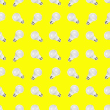 Sarı zemin üzerinde kusursuz LED lambalar deseni.