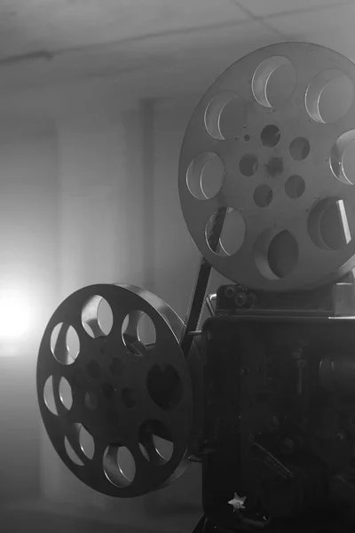 Vintage movie projector. Film reels. Black and white. Still life, close-up