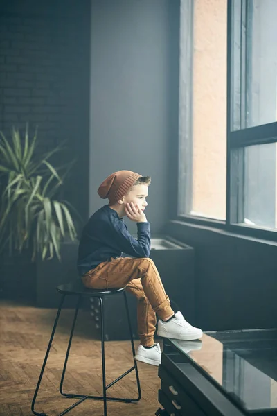 Fashionable Boy Sitting Chair Window Loft Apartment Plant Backgroung — Stock Photo, Image