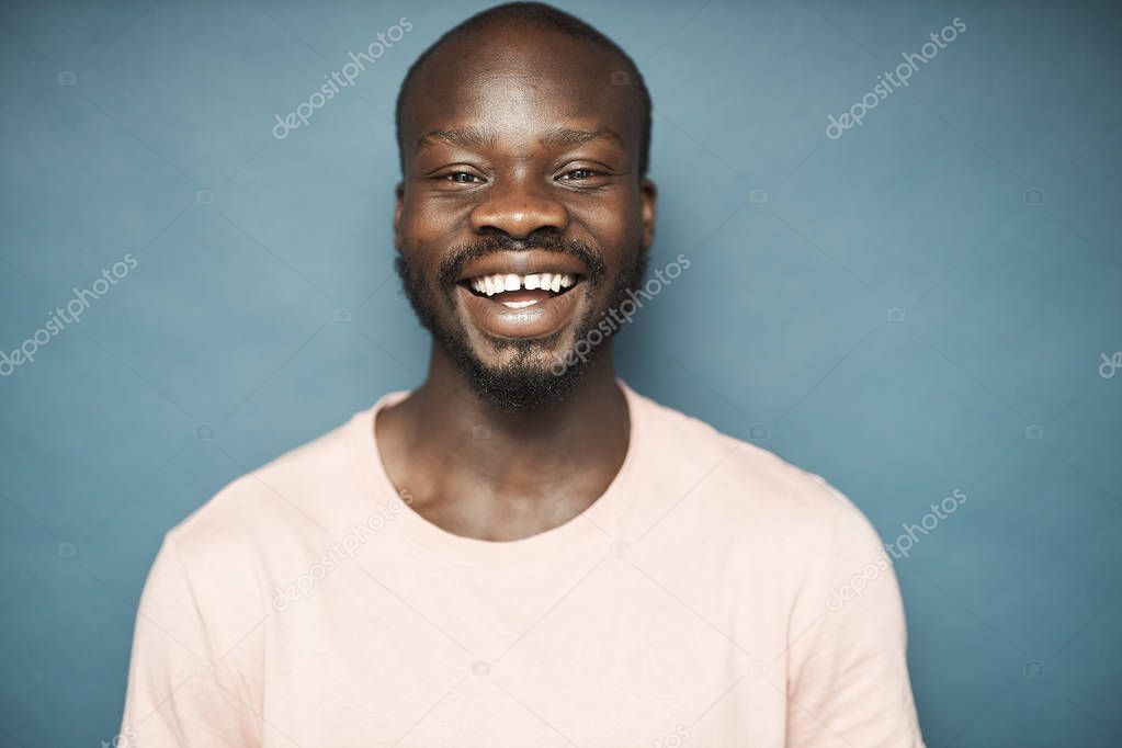 Smiling man on grey background