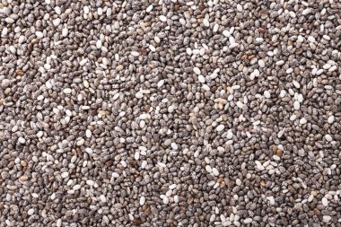 Arka plan olarak chia tohumları, sağlıklı süper yiyecekler. Üst görünüm, makro görünüm