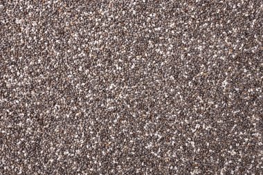 Arka plan olarak chia tohumları, sağlıklı süper yiyecekler. Üst görünüm, yakın görünüm